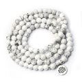 White beaded bracelet with silver accents on a white background